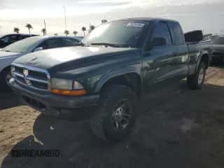 2002 Dodge Dakota z VIN 1B7GG12X52S705975, wystawiony jako Copart lot #75224734 z przebiegiem 150 441 mil mil oraz Szkoda całkowita • Salvage title. Historia ofert i sprzedaży dostępna na DreamBid. Obrazek 1.
