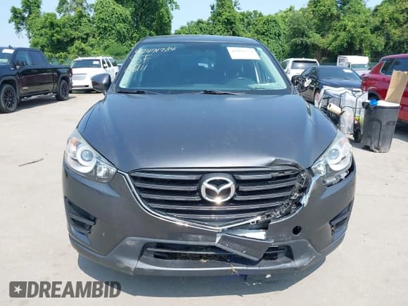 ✅ 2016 Mazda CX-5 Sport • VIN: JM3KE2BE0G0857015 • Lot: 42471734. Listed on IAAI with 81,401 mi. Free auction sales archive from the USA and detailed vehicle history report at DreamBid. Image 13.