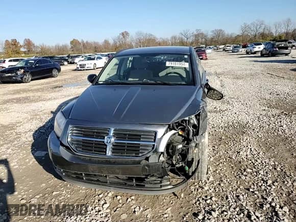 2011 Dodge Caliber Mainstreet с VIN 1B3CB3HA9BD295344, выставлен на аукционе Copart как лот 79101994 с пробегом Не указан миль и Списание • Salvage title. История ставок и продаж доступна на DreamBid. Изображение 11.