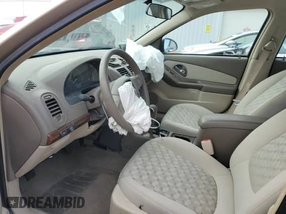 2005 Chevrolet Malibu LS z VIN 1G1ZT54825F274812, wystawiony jako Copart lot #77692784 z przebiegiem 138 306 mil mil oraz Szkoda całkowita • Salvage title. Historia ofert i sprzedaży dostępna na DreamBid. Obrazek 7.