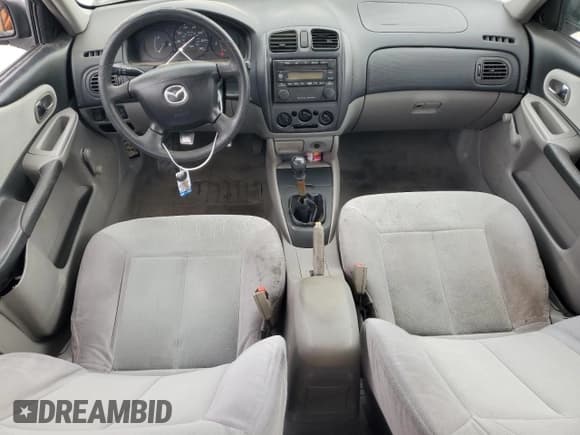 ✅ 2001 Mazda Protege DX • VIN: JM1BJ222310425181 • Lot: 88560255. Wystawiony na Copart z przebiegiem 201 942 mil. Bezpłatny archiwum sprzedaży aukcyjnych z USA i szczegółowy raport historii pojazdu na DreamBid. Zdjęcie 8.