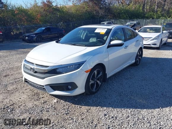 ✅ 2017 Honda Civic Touring • VIN: 19XFC1F93HE018721 • Лот: 43697842. Опубликован ранее на IAAI с пробегом 142 413 миль. Бесплатный доступ к архиву аукционных продаж из США и подробный отчёт об истории автомобиля на DreamBid. Изображение 2.