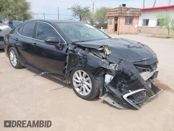 2022 Toyota Camry LE z VIN 4T1C11AK0NU651396, wystawiony jako IAAI lot #43411892 z przebiegiem 62 231 mil mil oraz . Historia ofert i sprzedaży dostępna na DreamBid. Obrazek 1.