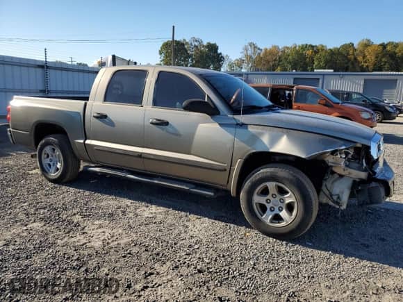 2006 Dodge Dakota SLT with VIN 1D7HE48K56S519839, listed as a Copart auction lot 77270724 with 202,320 mi miles and Salvage title. Bid and sale history available at DreamBid. Image 4.