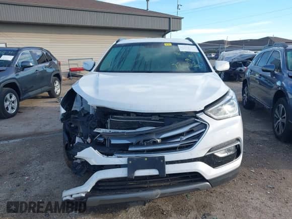 2018 Hyundai Santa Fe 2.4L z VIN 5NMZUDLB1JH097002, wystawiony jako IAAI lot #43473652 z przebiegiem 182 069 mil mil oraz . Historia ofert i sprzedaży dostępna na DreamBid. Obrazek 13.