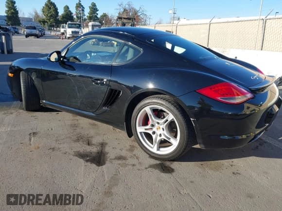 ✅ 2010 Porsche Cayman S • VIN: WP0AB2A88AU780290 • Lot: 41387293. Listed on IAAI with 76,091 mi. Free auction sales archive from the USA and detailed vehicle history report at DreamBid. Image 3.