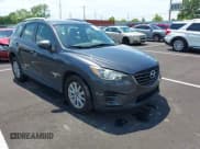 ✅ 2016 Mazda CX-5 Sport • VIN: JM3KE4BY4G0783619 • Lot: 42368512. Listed on IAAI with 115,694 mi. Free auction sales archive from the USA and detailed vehicle history report at DreamBid. Image 1.