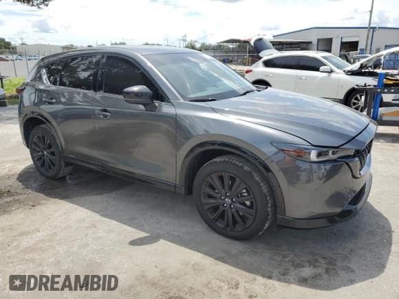 ✅ 2022 Mazda CX-5 2.5 Turbo • VIN: JM3KFBAY6N0607767 • Лот: 71276325. Опубликован ранее на Copart с пробегом 63 133 миль. Бесплатный доступ к архиву аукционных продаж из США и подробный отчёт об истории автомобиля на DreamBid. Изображение 4.