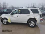 ✅ 2010 Mercury Mariner Premier • VIN: 4M2CN9HG8AKJ09679 • Lot: 41472049. Listed on IAAI with 99,554 mi. Free auction sales archive from the USA and detailed vehicle history report at DreamBid. Image 13.