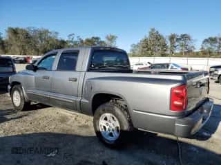 2005 Dodge Dakota SLT с VIN 1D7HE48N55S160968, выставлен на аукционе Copart как лот 76447804 с пробегом 149 357 миль миль и Списание • Salvage title. История ставок и продаж доступна на DreamBid. Изображение 2.