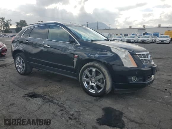 ✅ 2012 Cadillac SRX Performance Collection • VIN: 3GYFNBE31CS577198 • Lot: 81932555. Listed on Copart with 194,810 mi. Free auction sales archive from the USA and detailed vehicle history report at DreamBid. Image 4.