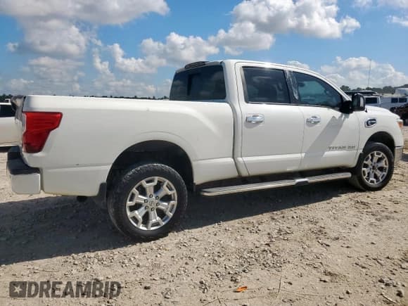 ✅ 2017 Nissan Titan Pro-4X • VIN: 1N6BA1F43HN571080 • Лот: 69094435. Опубликован ранее на Copart с пробегом 166 610 миль. Бесплатный доступ к архиву аукционных продаж из США и подробный отчёт об истории автомобиля на DreamBid. Изображение 3.