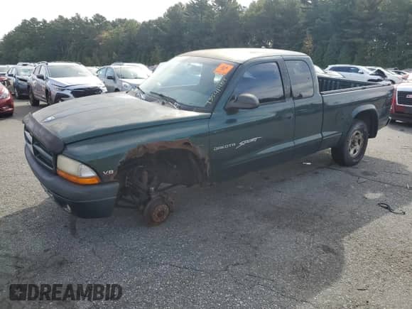 1999 Dodge Dakota SLT z VIN 1B7GG22Y5XS202324, wystawiony jako Copart lot #73541484 z przebiegiem Nie podano mil oraz Czysty tytuł • Clean title. Historia ofert i sprzedaży dostępna na DreamBid. Obrazek 1.