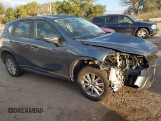 ✅ 2016 Mazda CX-5 Sport • VIN: JM3KE4BY4G0660953 • Lot: 43450266. Wystawiony na IAAI z przebiegiem 140 627 mil. Bezpłatny archiwum sprzedaży aukcyjnych z USA i szczegółowy raport historii pojazdu na DreamBid. Zdjęcie 1.