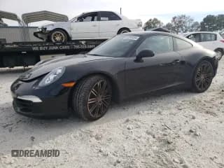 ✅ 2016 Porsche 911 Carrera • VIN: WP0AA2A91GS106403 • Lot: 83393454. Wystawiony na Copart z przebiegiem 115 592 mil. Bezpłatny archiwum sprzedaży aukcyjnych z USA i szczegółowy raport historii pojazdu na DreamBid. Zdjęcie 1.