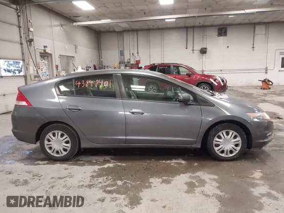 ✅ 2010 Honda Insight LX • VIN: JHMZE2H58AS038570 • Lot: 43848401. Listed on IAAI with 158,775 mi. Free auction sales archive from the USA and detailed vehicle history report at DreamBid. Image 14.
