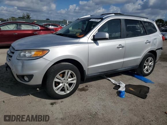 ✅ 2012 Hyundai Santa Fe Limited • VIN: 5XYZK4AG4CG164046 • Lot: 86106994. Listed on Copart with 140,418 mi. Free auction sales archive from the USA and detailed vehicle history report at DreamBid. Image 1.