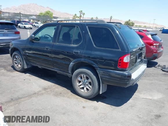 ✅ 2004 Isuzu Rodeo S • VIN: 4S2CK58YX44311680 • Lot: 42476361. Listed on IAAI with 154,693 mi. Free auction sales archive from the USA and detailed vehicle history report at DreamBid. Image 3.