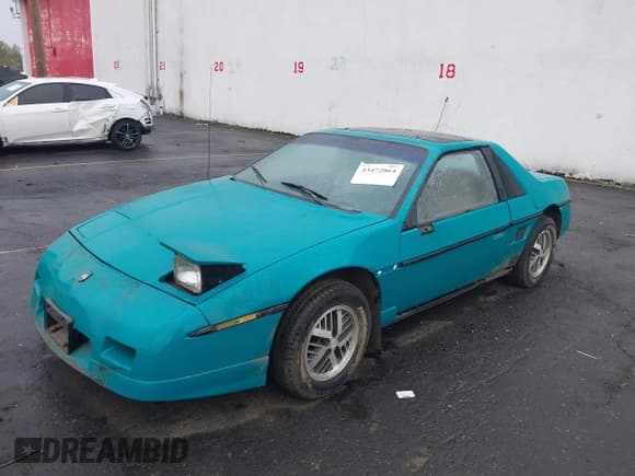 ✅ 1988 Pontiac Fiero • VIN: 1G2PE11R1JP210798 • Lot: 43472064. Wystawiony na IAAI z przebiegiem 136 233 mil. Bezpłatny archiwum sprzedaży aukcyjnych z USA i szczegółowy raport historii pojazdu na DreamBid. Zdjęcie 2.