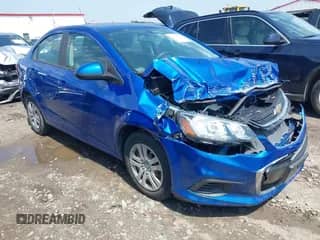2018 Chevrolet Sonic LS z VIN 1G1JB5SHXJ4103573, wystawiony jako IAAI lot #42162858 z przebiegiem 29 954 mil mil oraz . Historia ofert i sprzedaży dostępna na DreamBid. Obrazek 1.