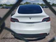 ✅ 2021 Tesla Model Y Standard Range • VIN: 5YJYGDED3MF173455 • Lot: 42591864. Listed on IAAI with 42,726 mi. Free auction sales archive from the USA and detailed vehicle history report at DreamBid. Image 16.