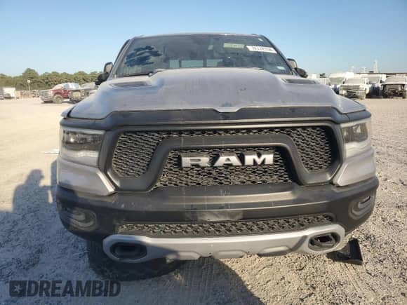 2020 Ram 1500 Rebel с VIN 1C6RRELT7LN299176, выставлен на аукционе Copart как лот 76778334 с пробегом 70 059 миль миль и Списание • Salvage title. История ставок и продаж доступна на DreamBid. Изображение 5.