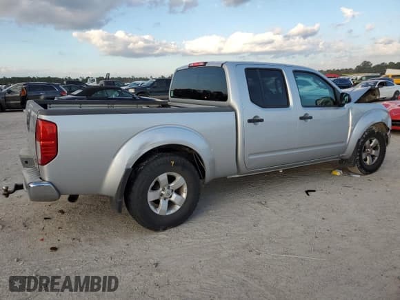 ✅ 2009 Nissan Frontier SE • VIN: 1N6AD09W29C400098 • Lot: 82475364. Listed on Copart with 100,442 mi. Free auction sales archive from the USA and detailed vehicle history report at DreamBid. Image 3.