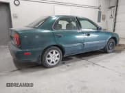 ✅ 1999 Suzuki Esteem • VIN: JS2GB31S2X5162466 • Lot: 42326400. Listed on IAAI with 144,492 mi. Free auction sales archive from the USA and detailed vehicle history report at DreamBid. Image 4.