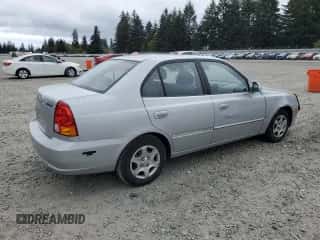 2005 Hyundai Accent GLS z VIN KMHCG45C75U639281, wystawiony jako Copart lot #54887095 z przebiegiem 136 090 mil mil oraz Szkoda całkowita • Salvage title. Historia ofert i sprzedaży dostępna na DreamBid. Obrazek 3.