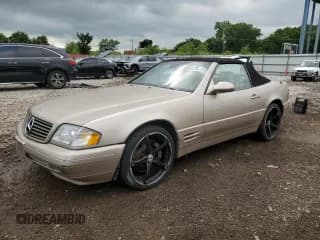 ✅ 2000 Mercedes-Benz SL 500 • VIN: WDBFA68F1YF195102 • Лот: 65043725. Опубликован ранее на Copart с пробегом 96 355 миль. Бесплатный доступ к архиву аукционных продаж из США и подробный отчёт об истории автомобиля на DreamBid. Изображение 1.