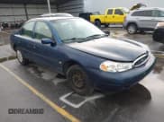 ✅ 1998 Ford Contour • VIN: 3FAFP663XWM122628 • Lot: 42692574. Listed on IAAI with 227,055 mi. Free auction sales archive from the USA and detailed vehicle history report at DreamBid. Image 1.