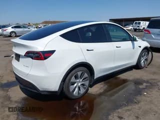 ✅ 2023 Tesla Model Y Long Range • VIN: 7SAYGAEE3PF826073 • Lot: 43104047. Listed on IAAI with 34,524 mi. Free auction sales archive from the USA and detailed vehicle history report at DreamBid. Image 4.