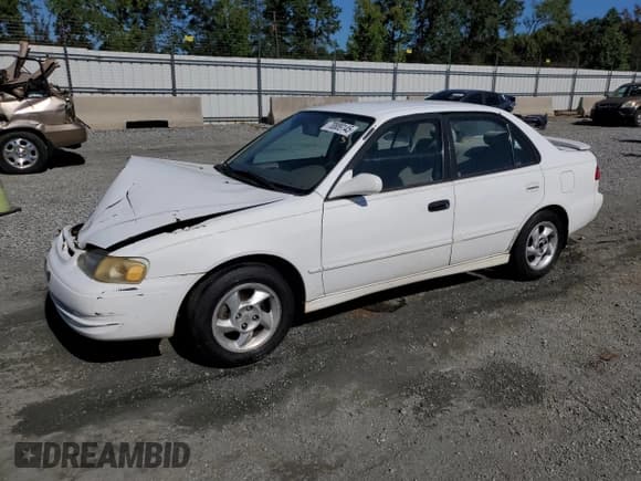 ✅ 1999 Toyota Corolla LE • VIN: 2T1BR12E0XC125030 • Lot: 70889145. Listed on Copart with 153,923 mi. Free auction sales archive from the USA and detailed vehicle history report at DreamBid. Image 1.