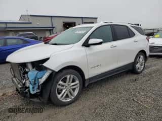 2019 Chevrolet Equinox Premier z VIN 2GNAXPEXXK6263631, wystawiony jako Copart lot #90412435 z przebiegiem 64 953 mil mil oraz Szkoda całkowita • Salvage title. Historia ofert i sprzedaży dostępna na DreamBid. Obrazek 1.