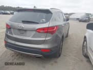 ✅ 2014 Hyundai Santa Fe • VIN: 5XYZUDLB0EG150479 • Lot: 43361152. Listed on IAAI with 163,969 mi. Free auction sales archive from the USA and detailed vehicle history report at DreamBid. Image 4.