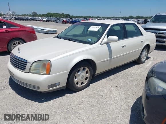 ✅ 2002 Cadillac DeVille • VIN: 1G6KD54Y52U251010 • Lot: 42817879. Listed on IAAI with 100,397 mi. Free auction sales archive from the USA and detailed vehicle history report at DreamBid. Image 2.