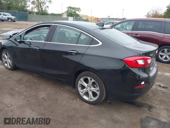 ✅ 2018 Chevrolet Cruze Premier • VIN: 1G1BF5SM1J7141701 • Lot: 43449111. Listed on IAAI with 128,825 mi. Free auction sales archive from the USA and detailed vehicle history report at DreamBid. Image 3.