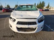 ✅ 2014 Chevrolet Sonic LTZ • VIN: 1G1JE5SG1E4127653 • Lot: 93331635. Listed on Copart with Not provided. Free auction sales archive from the USA and detailed vehicle history report at DreamBid. Image 5.