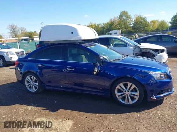 2013 Chevrolet Cruze LTZ z VIN 1G1PG5SBXD7226882, wystawiony jako IAAI lot #43396275 z przebiegiem 140 683 mil mil oraz . Historia ofert i sprzedaży dostępna na DreamBid. Obrazek 13.
