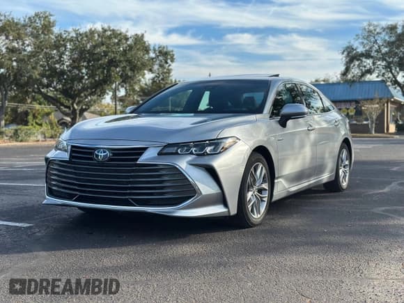 ✅ 2020 Toyota Avalon Hybrid XLE • VIN: 4T1A21FBXLU016423 • Лот: 88176295. Опубликован ранее на Copart с пробегом 25 476 миль. Бесплатный доступ к архиву аукционных продаж из США и подробный отчёт об истории автомобиля на DreamBid. Изображение 2.