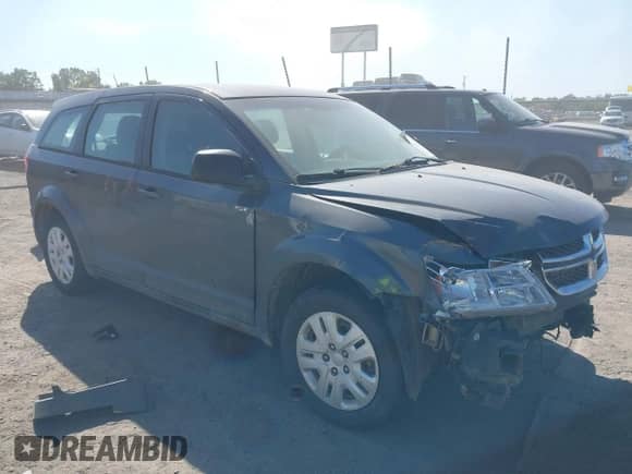 2015 Dodge Journey American Value z VIN 3C4PDCAB7FT559299, wystawiony jako IAAI lot #43409195 z przebiegiem 183 905 mil mil oraz . Historia ofert i sprzedaży dostępna na DreamBid. Obrazek 1.