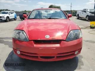 2003 Hyundai Tiburon GT z VIN KMHHN65F33U088538, wystawiony jako Copart lot #54320955 z przebiegiem 220 732 mil mil oraz Szkoda całkowita • Salvage title. Historia ofert i sprzedaży dostępna na DreamBid. Obrazek 5.