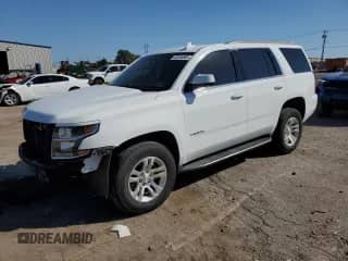 2018 Chevrolet Tahoe LS with VIN 1GNSCAKC0JR264403, listed as a Copart auction lot 82535665 with 136,629 mi miles and Salvage title. Bid and sale history available at DreamBid. Image 1.
