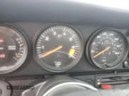 ✅ 1986 Porsche 911 • VIN: WP0EB0917GS161455 • Lot: 74672764. Wystawiony na Copart z przebiegiem 80 076 mil. Bezpłatny archiwum sprzedaży aukcyjnych z USA i szczegółowy raport historii pojazdu na DreamBid. Zdjęcie 9.