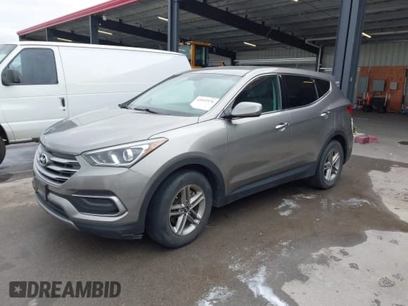 ✅ 2018 Hyundai Santa Fe 2.4L • VIN: 5NMZT3LBXJH080972 • Лот: 43542976. Опубликован ранее на IAAI с пробегом 76 144 миль. Бесплатный доступ к архиву аукционных продаж из США и подробный отчёт об истории автомобиля на DreamBid. Изображение 18.