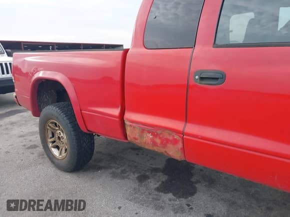 2003 Dodge Dakota Sport z VIN 1D7HG32N43S202783, wystawiony jako IAAI lot #42512950 z przebiegiem 217 105 mil mil oraz . Historia ofert i sprzedaży dostępna na DreamBid. Obrazek 6.