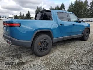 ✅ 2022 Rivian R1T Launch Edition • VIN: 7FCTGAAL0NN001418 • Lot: 75002264. Wystawiony na Copart z przebiegiem 28 835 mil. Bezpłatny archiwum sprzedaży aukcyjnych z USA i szczegółowy raport historii pojazdu na DreamBid. Zdjęcie 3.