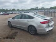 ✅ 2017 Ford Fusion Hybrid Titanium • VIN: 3FA6P0RU3HR188204 • Лот: 42618604. Опубликован ранее на IAAI с пробегом 104 609 миль. Бесплатный доступ к архиву аукционных продаж из США и подробный отчёт об истории автомобиля на DreamBid. Изображение 3.