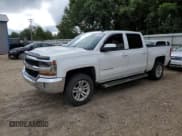 ✅ 2018 Chevrolet Silverado 1500 LT • VIN: 3GCPCREC6JG117589 • Лот: 68119944. Опубликован ранее на Copart с пробегом 143 978 миль. Бесплатный доступ к архиву аукционных продаж из США и подробный отчёт об истории автомобиля на DreamBid. Изображение 1.