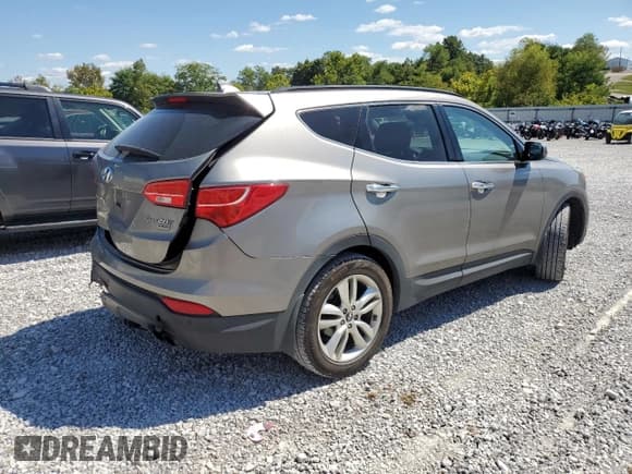 ✅ 2015 Hyundai Santa Fe • VIN: 5XYZW4LAXFG239754 • Lot: 71499665. Listed on Copart with 75,339 mi. Free auction sales archive from the USA and detailed vehicle history report at DreamBid. Image 3.